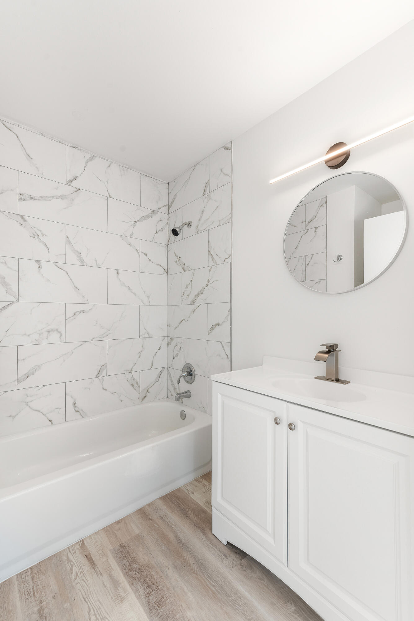 5629 Southeast Collins Avenue Stuart, FL 34997 - Photo 24 of 39 a bathroom with a bathtub and a sink