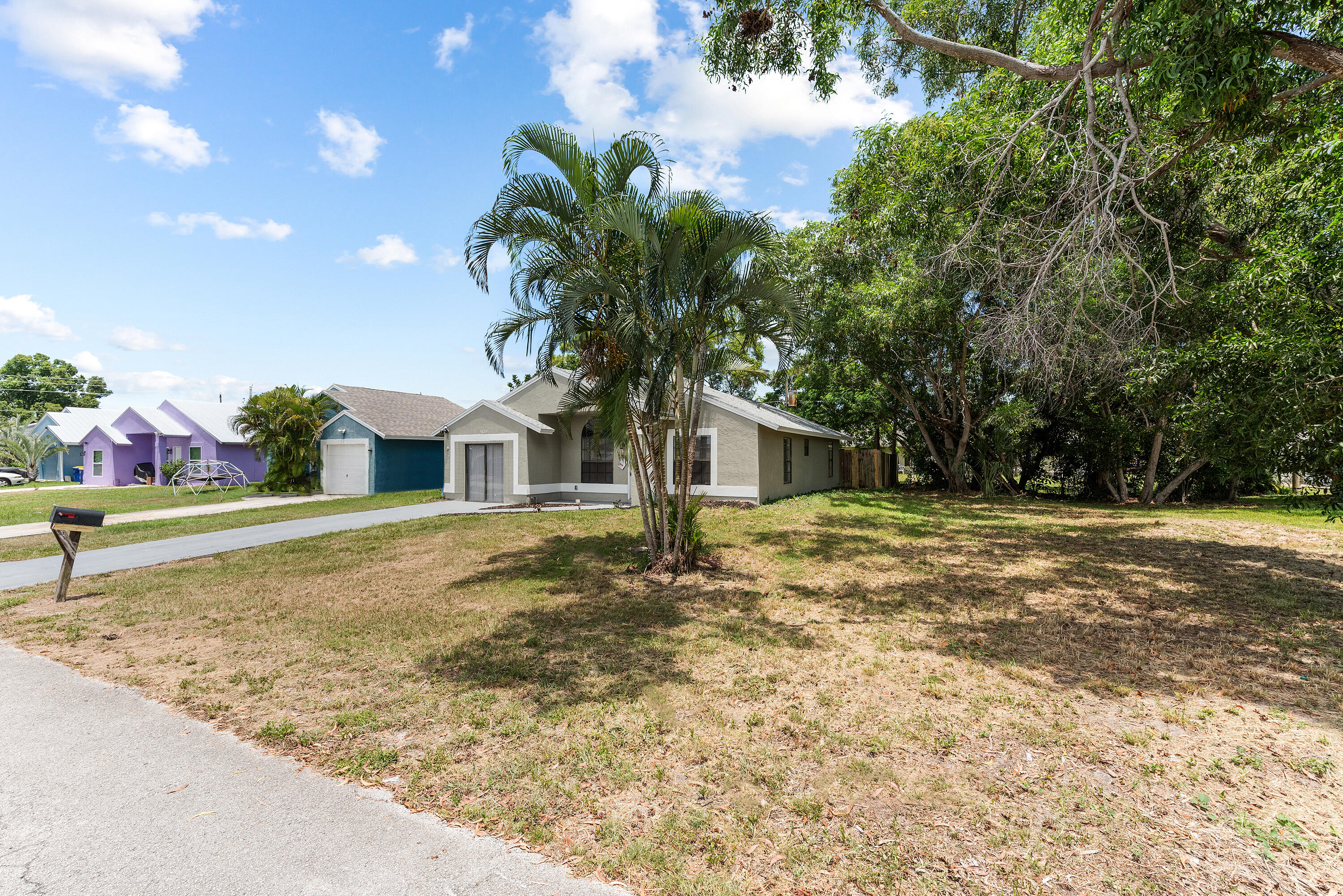 5629 Southeast Collins Avenue Stuart, FL 34997 - Photo 35 of 39 a house view with a outdoor space