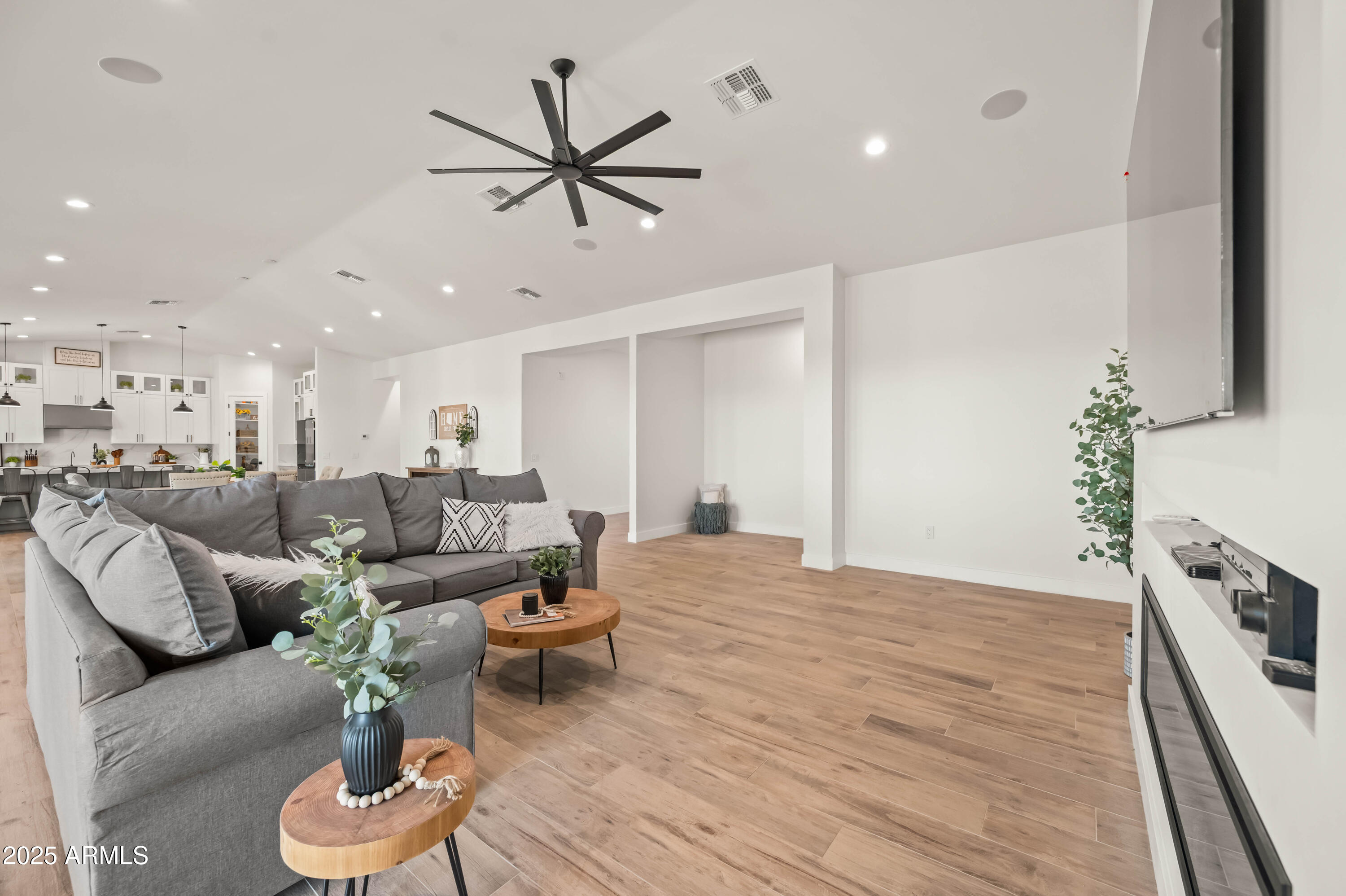 22145 West Harwell Road Buckeye, AZ 85326 - Photo 16 of 86 a living room with furniture and a wooden floor