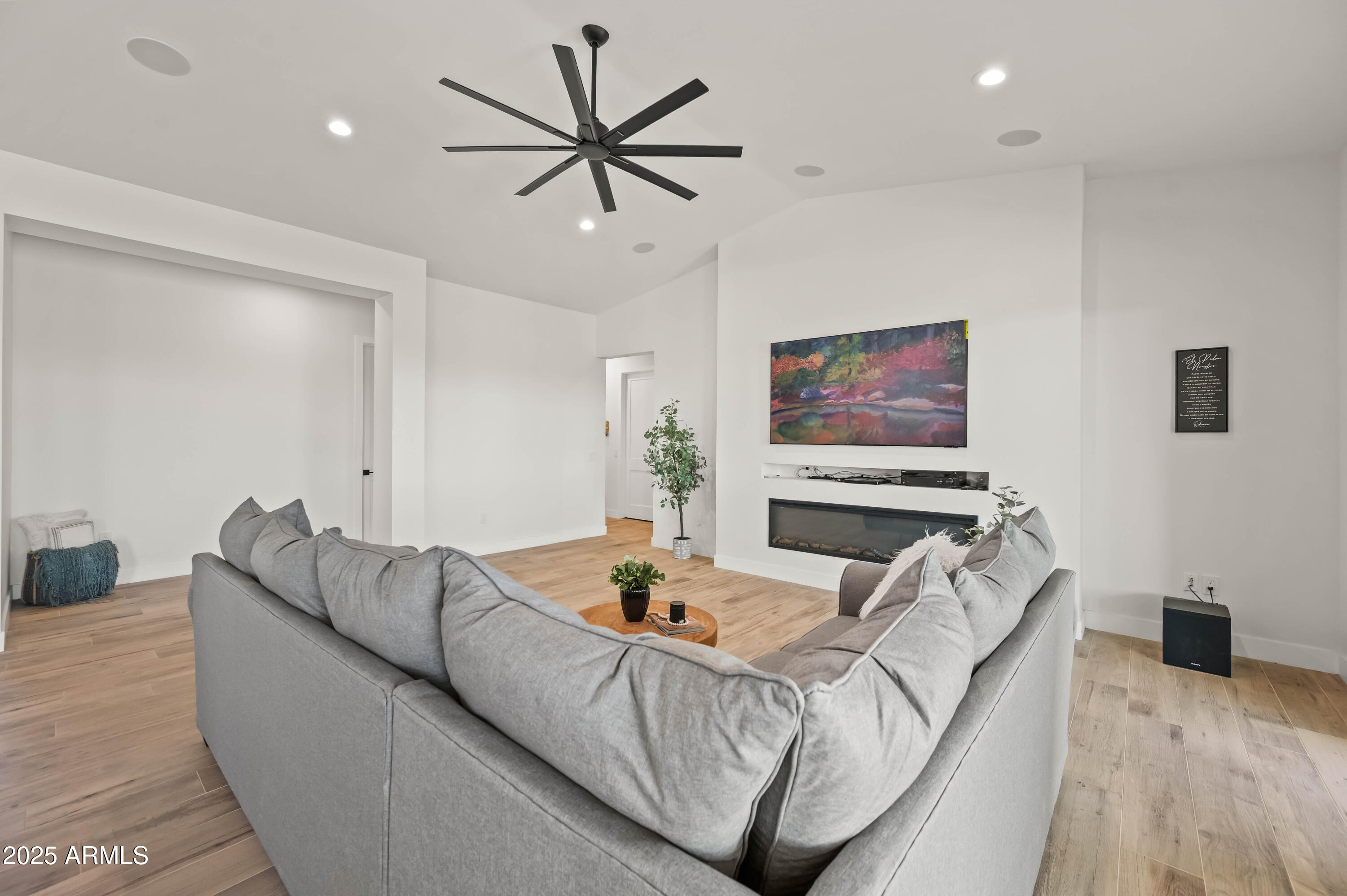 22145 West Harwell Road Buckeye, AZ 85326 - Photo 18 of 86 a living room with furniture and a flat screen tv