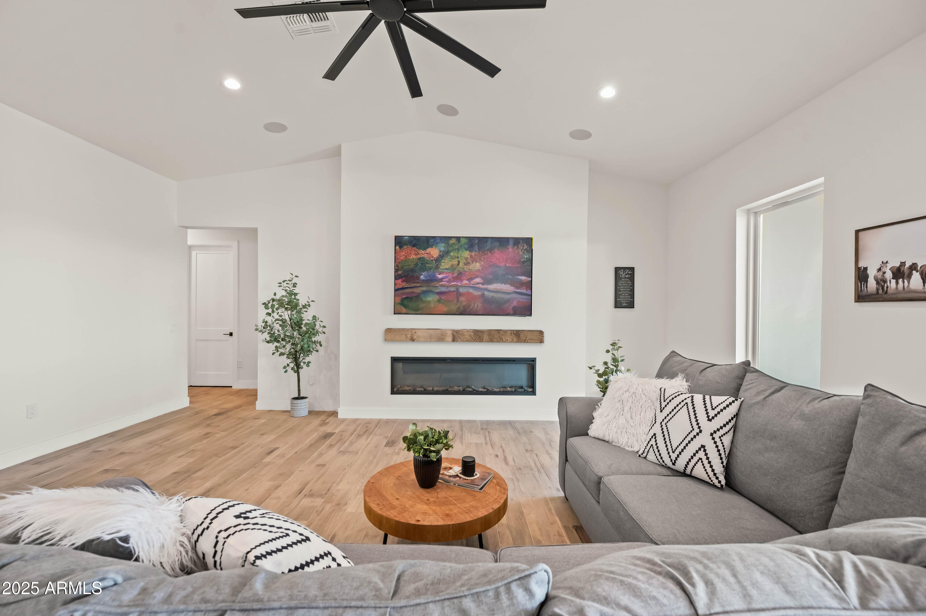 22145 West Harwell Road Buckeye, AZ 85326 - Photo 20 of 86 a living room with furniture and a flat screen tv
