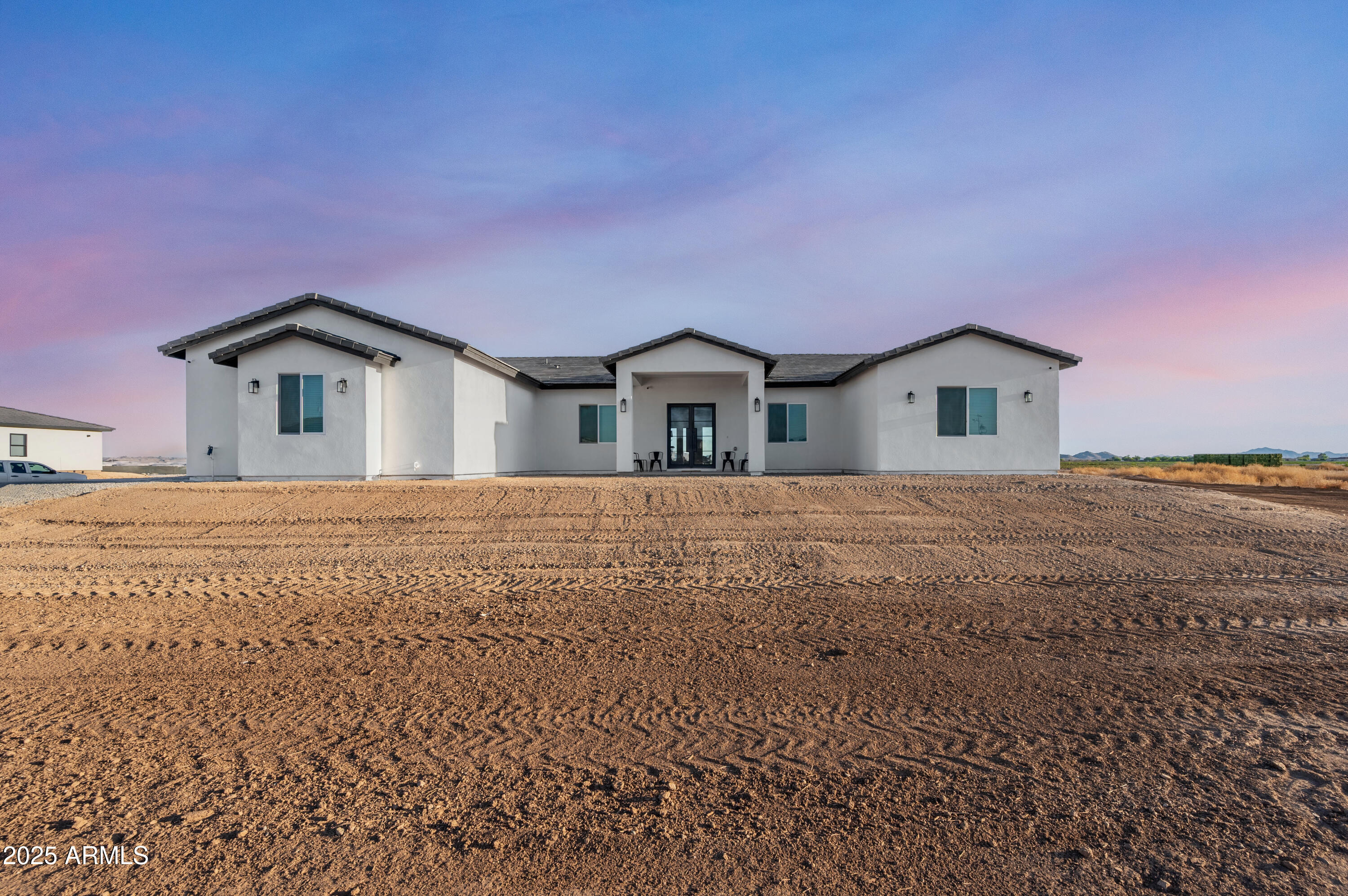 22145 West Harwell Road Buckeye, AZ 85326 - Photo 2 of 86 a front view of a house with a yard