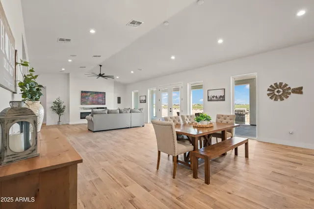 a kitchen with stainless steel appliances kitchen island granite countertop a sink a stove and cabinets