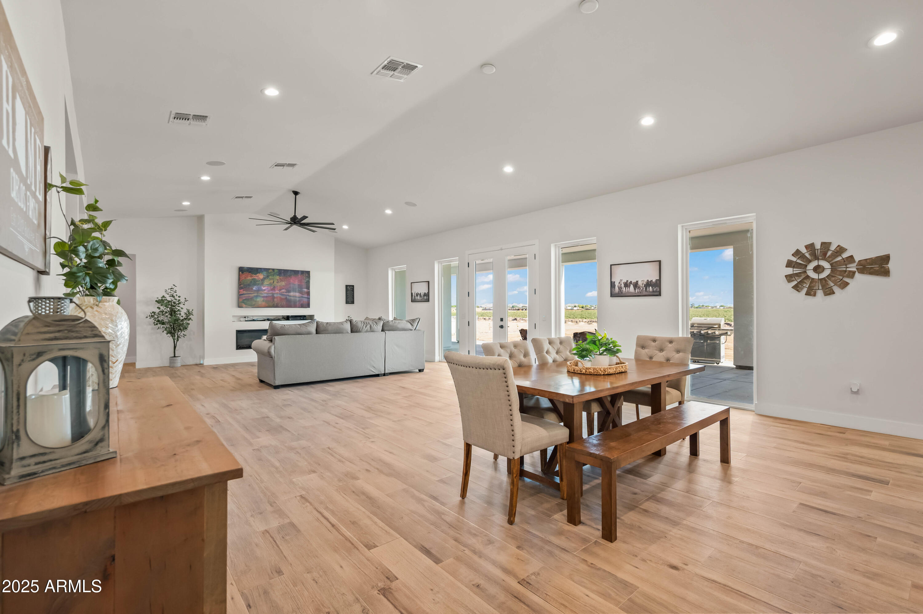 22145 West Harwell Road Buckeye, AZ 85326 - Photo 23 of 86 a living room with furniture a dining table and a potted plant