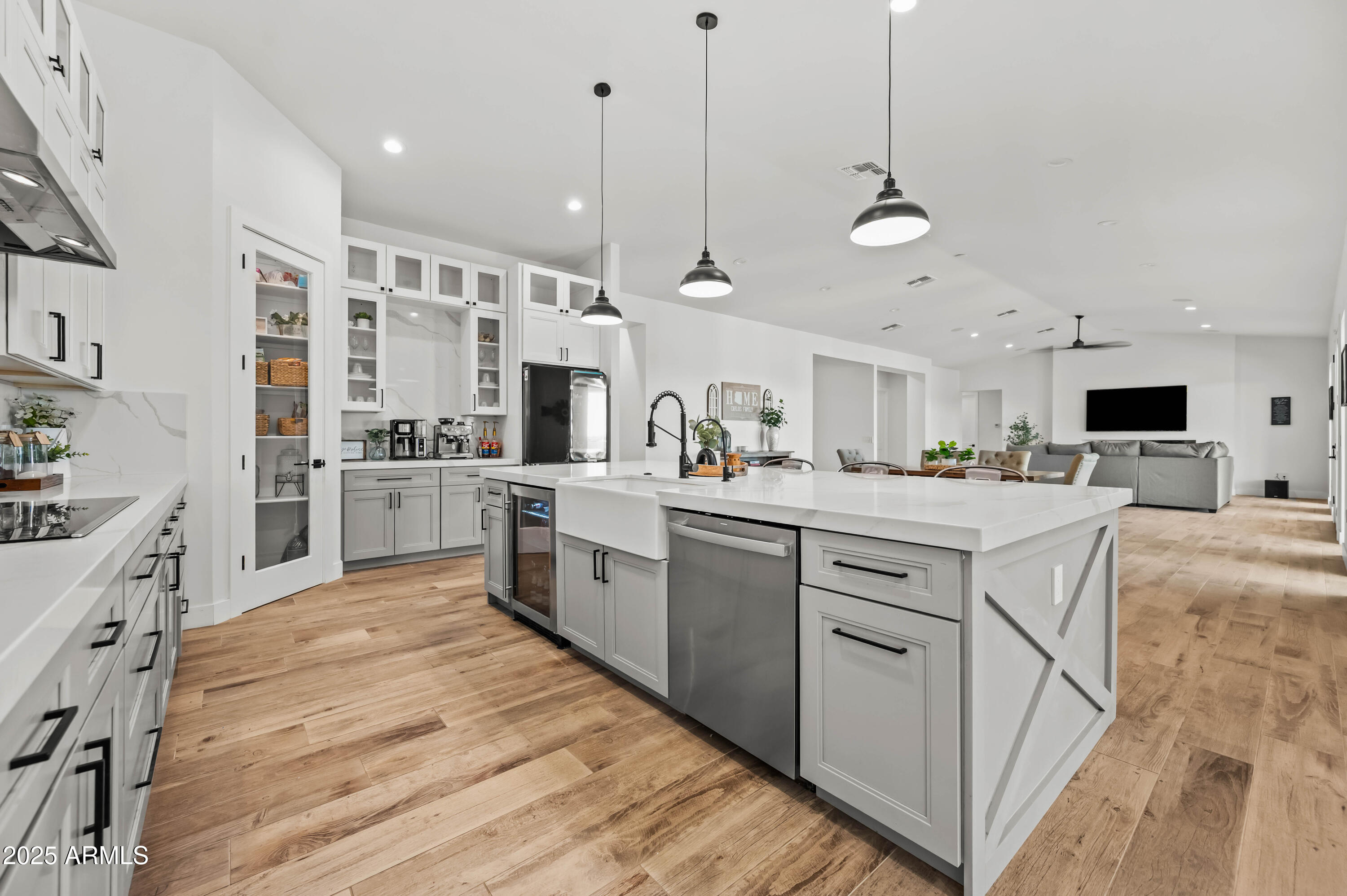 22145 West Harwell Road Buckeye, AZ 85326 - Photo 32 of 86 a kitchen with stainless steel appliances kitchen island granite countertop a sink a stove and cabinets