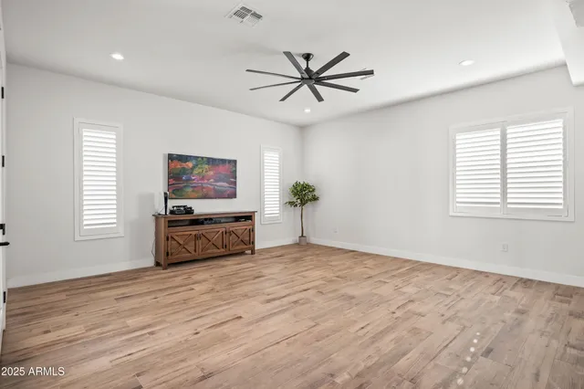 a bedroom with a bed a desk and chair