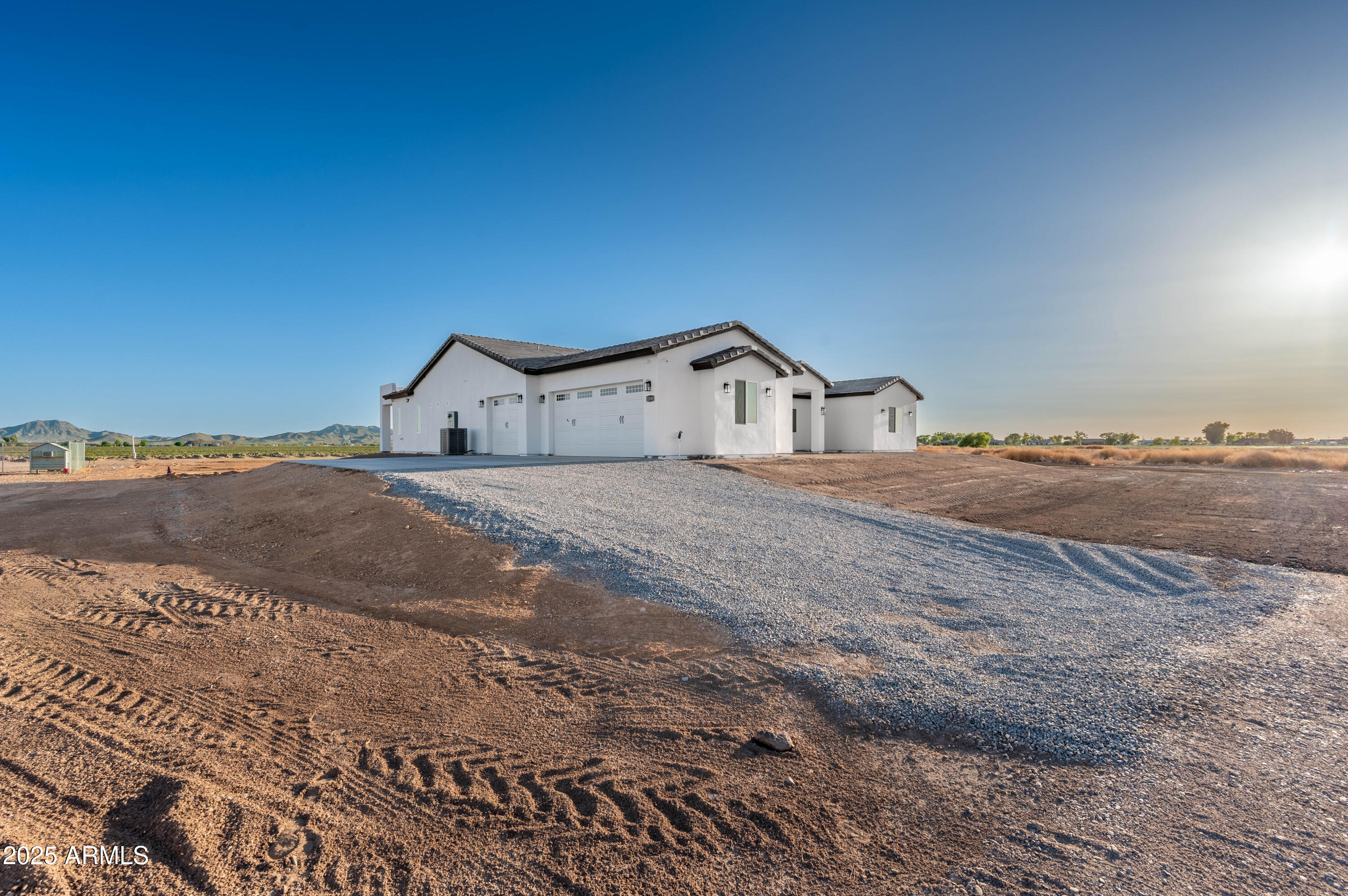 22145 West Harwell Road Buckeye, AZ 85326 - Photo 4 of 86 a view of a dry yard with wooden fence