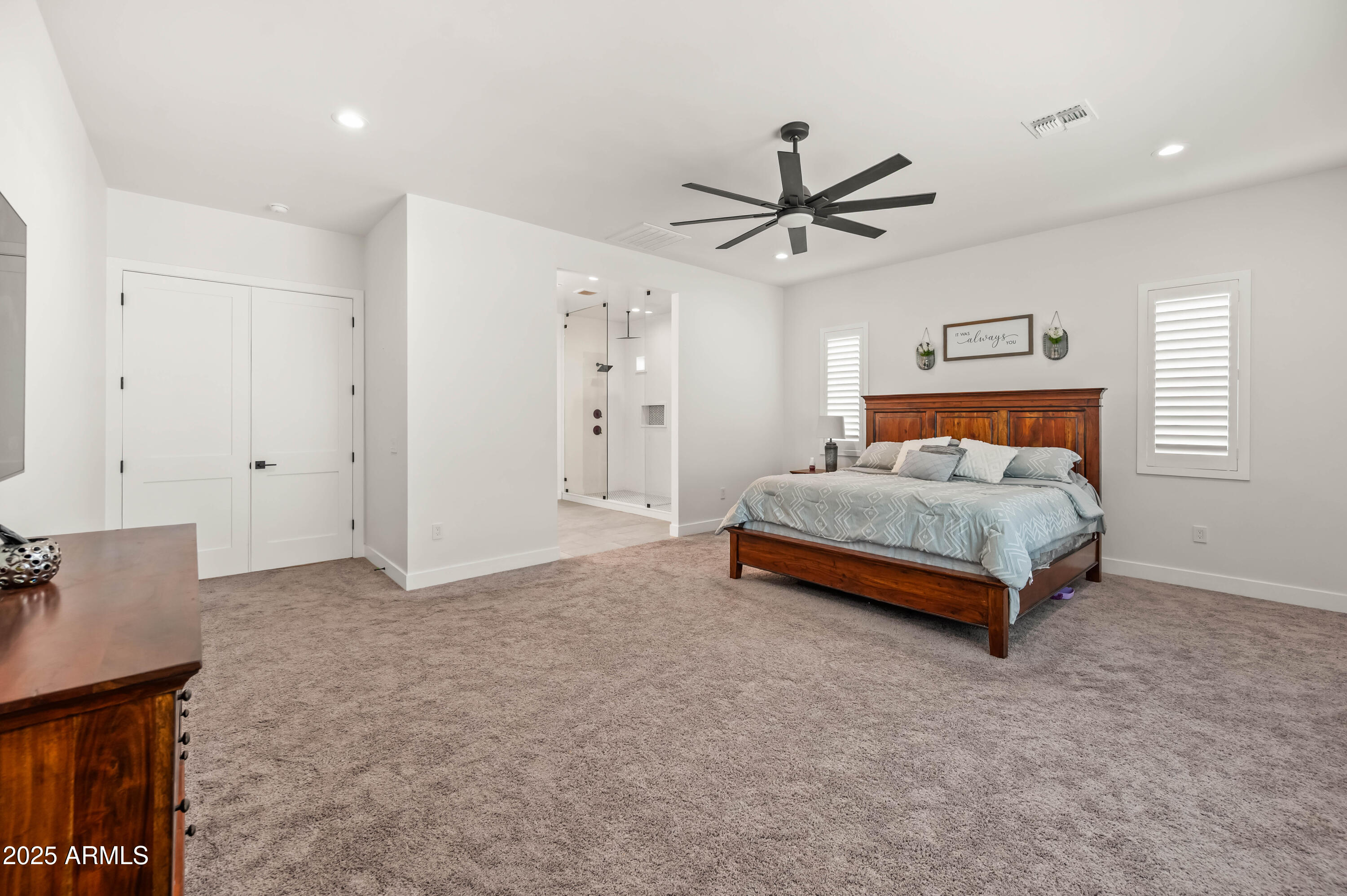 22145 West Harwell Road Buckeye, AZ 85326 - Photo 45 of 86 a bedroom with a bed and a ceiling fan