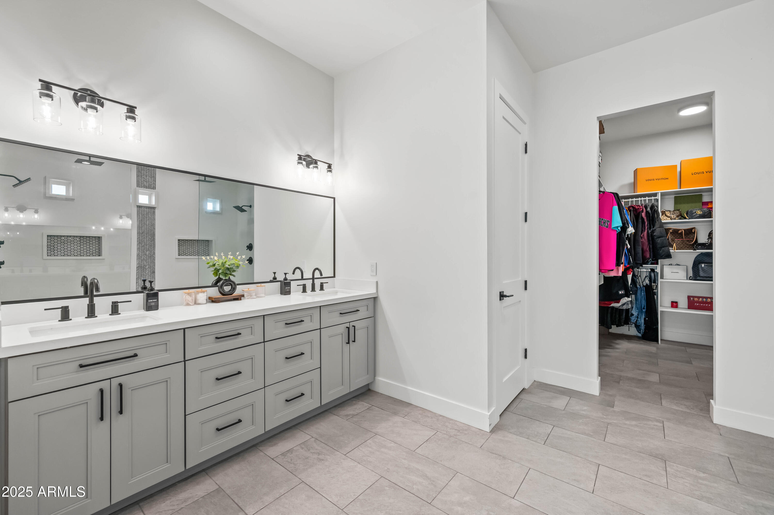 22145 West Harwell Road Buckeye, AZ 85326 - Photo 52 of 86 a spacious bathroom with a double vanity sink mirror and shower