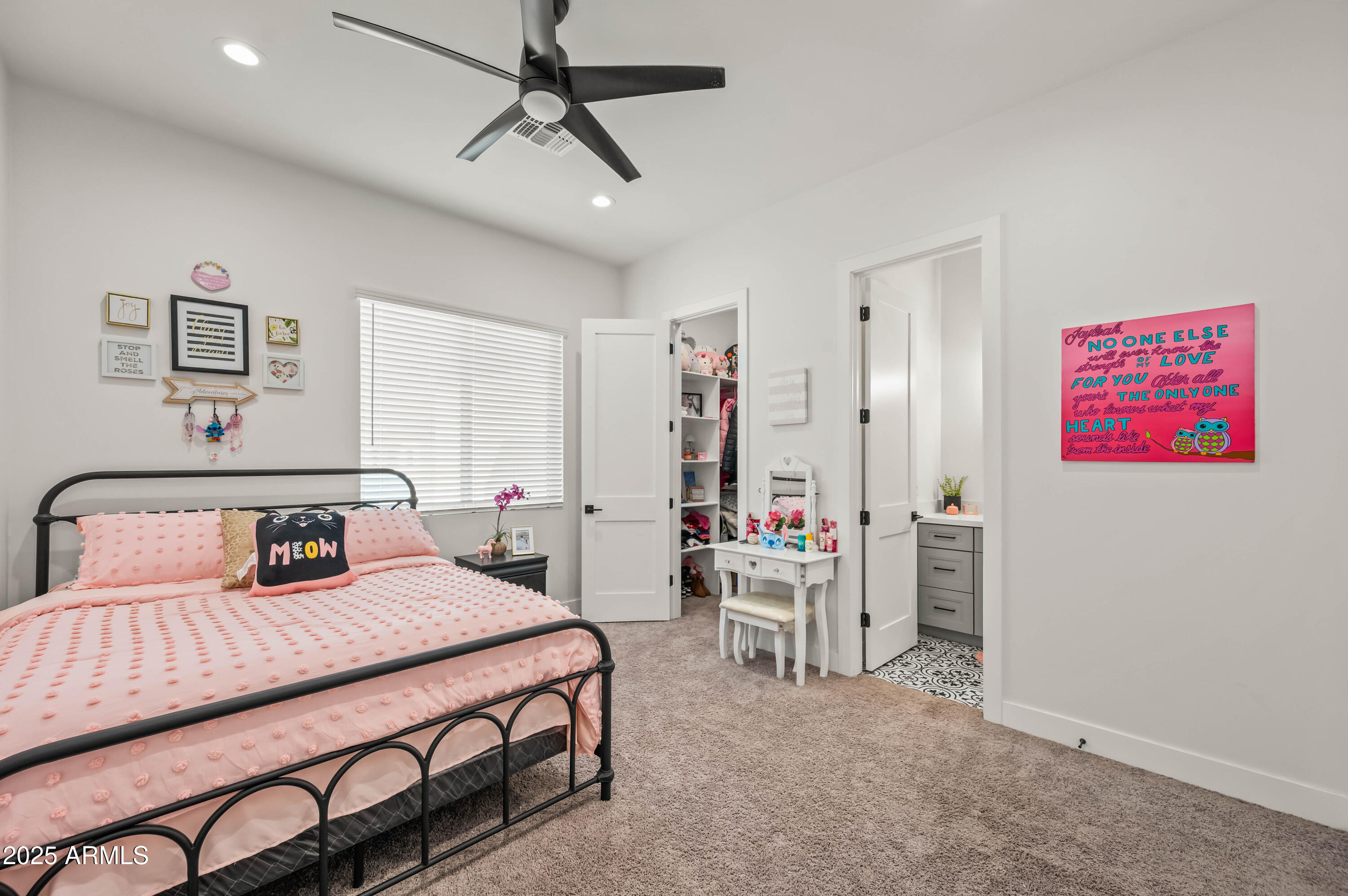 22145 West Harwell Road Buckeye, AZ 85326 - Photo 56 of 86 a bedroom with a bed a desk and chair