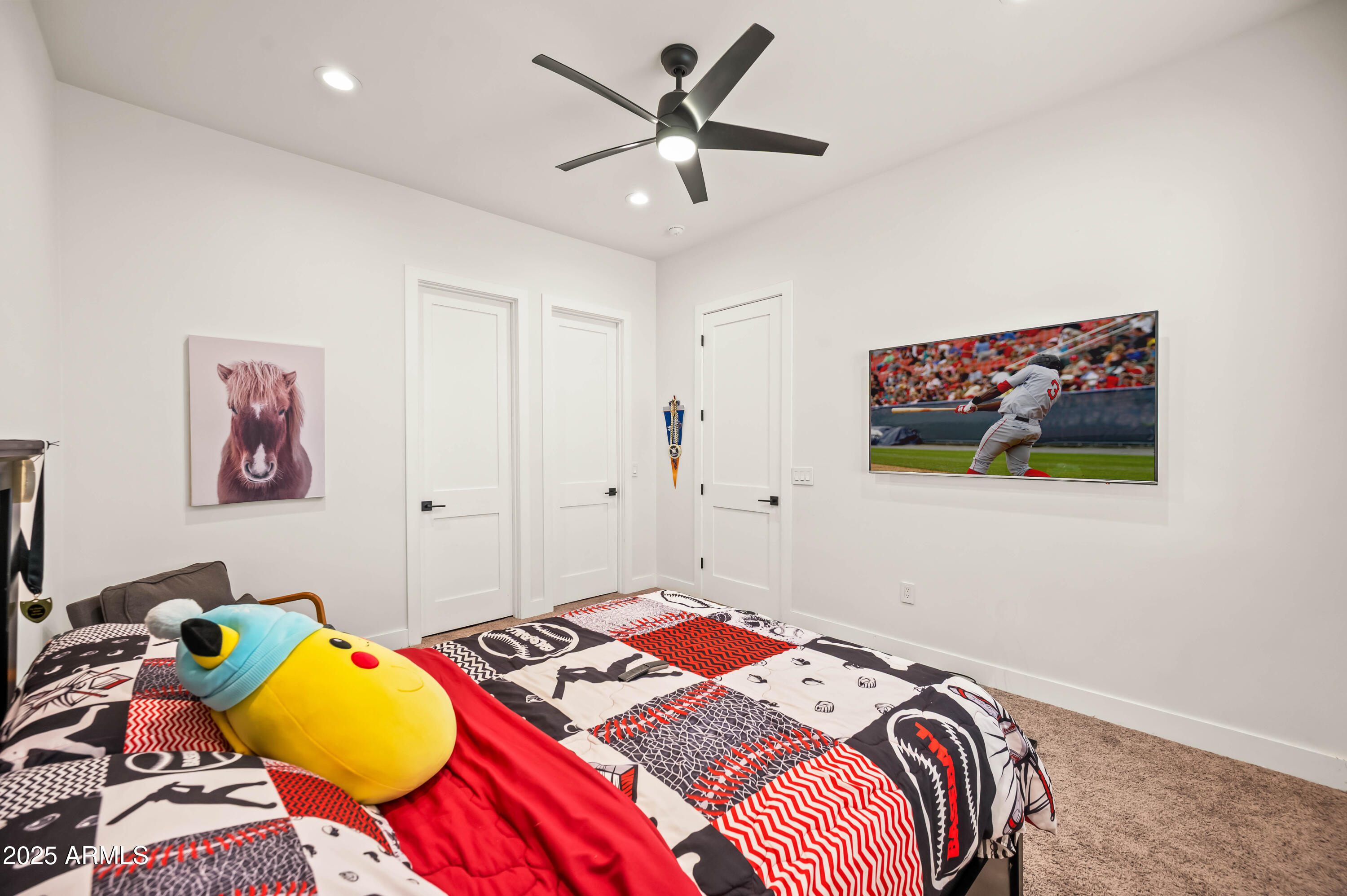 22145 West Harwell Road Buckeye, AZ 85326 - Photo 62 of 86 a bedroom with a bed and a chandelier