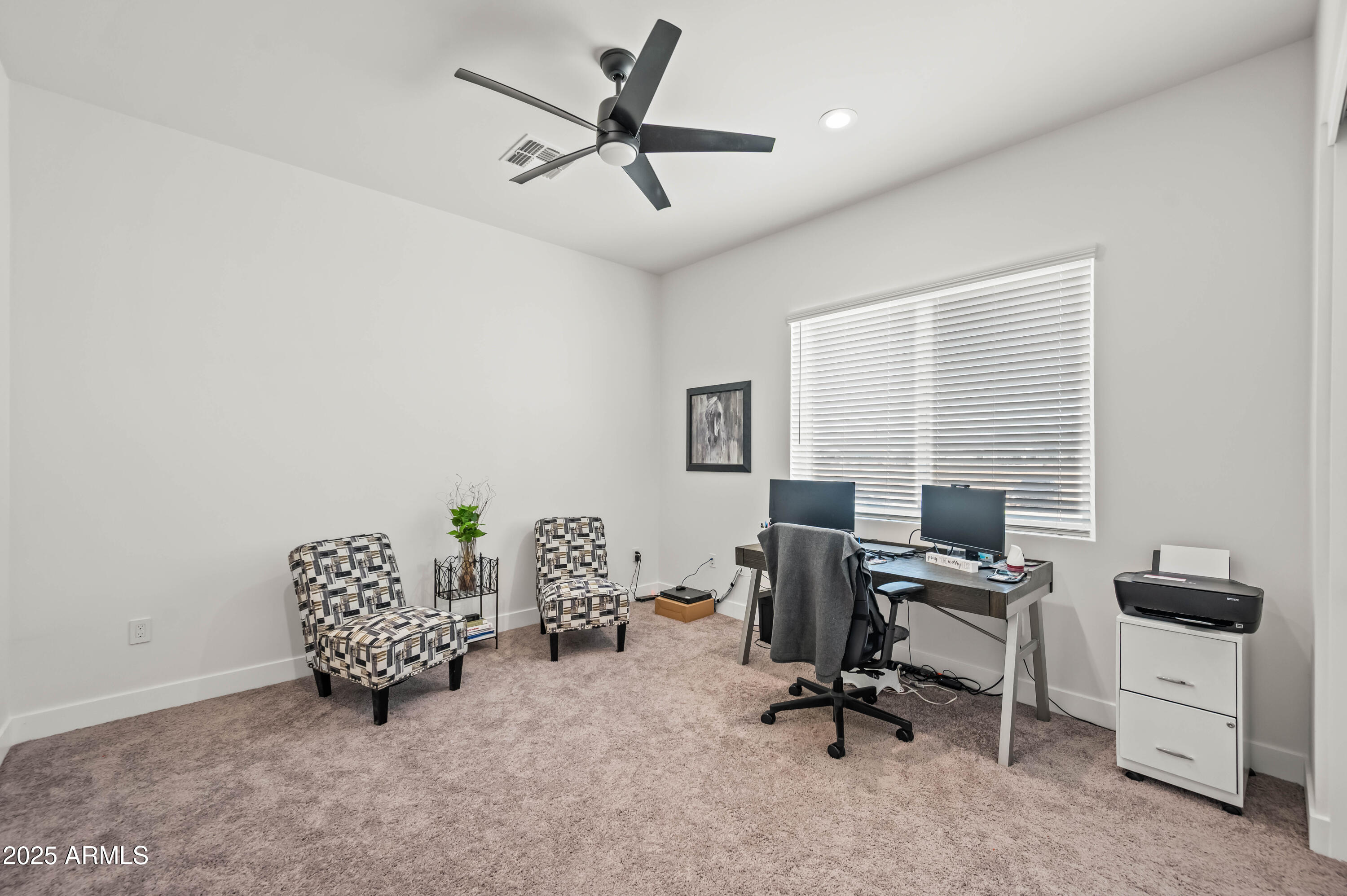 22145 West Harwell Road Buckeye, AZ 85326 - Photo 68 of 86 a view of a workspace with furniture and a window