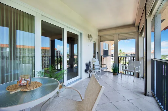 a kitchen with stainless steel appliances a stove microwave and refrigerator