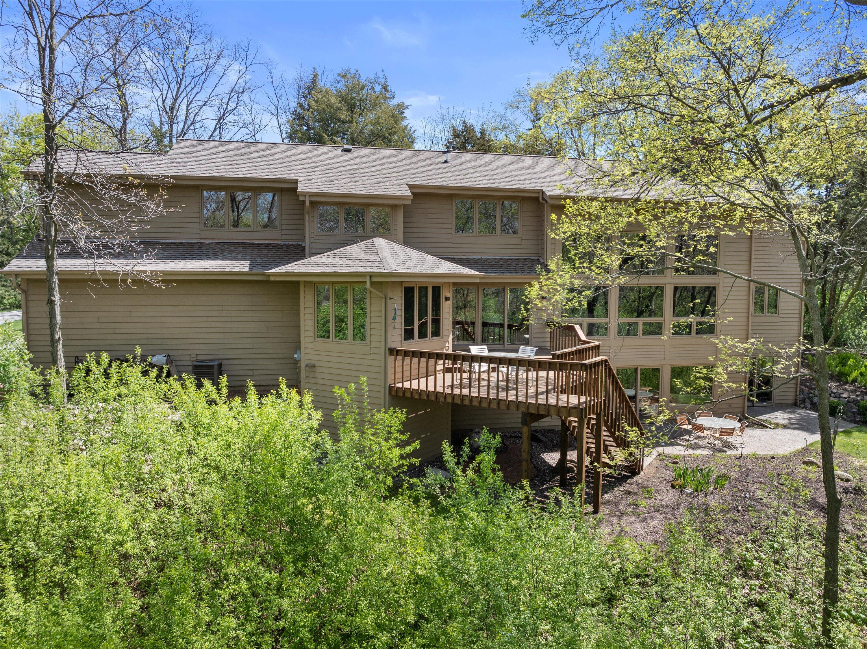 Stunning custom built contemporary home set on private 2.1 acre wooded lot.