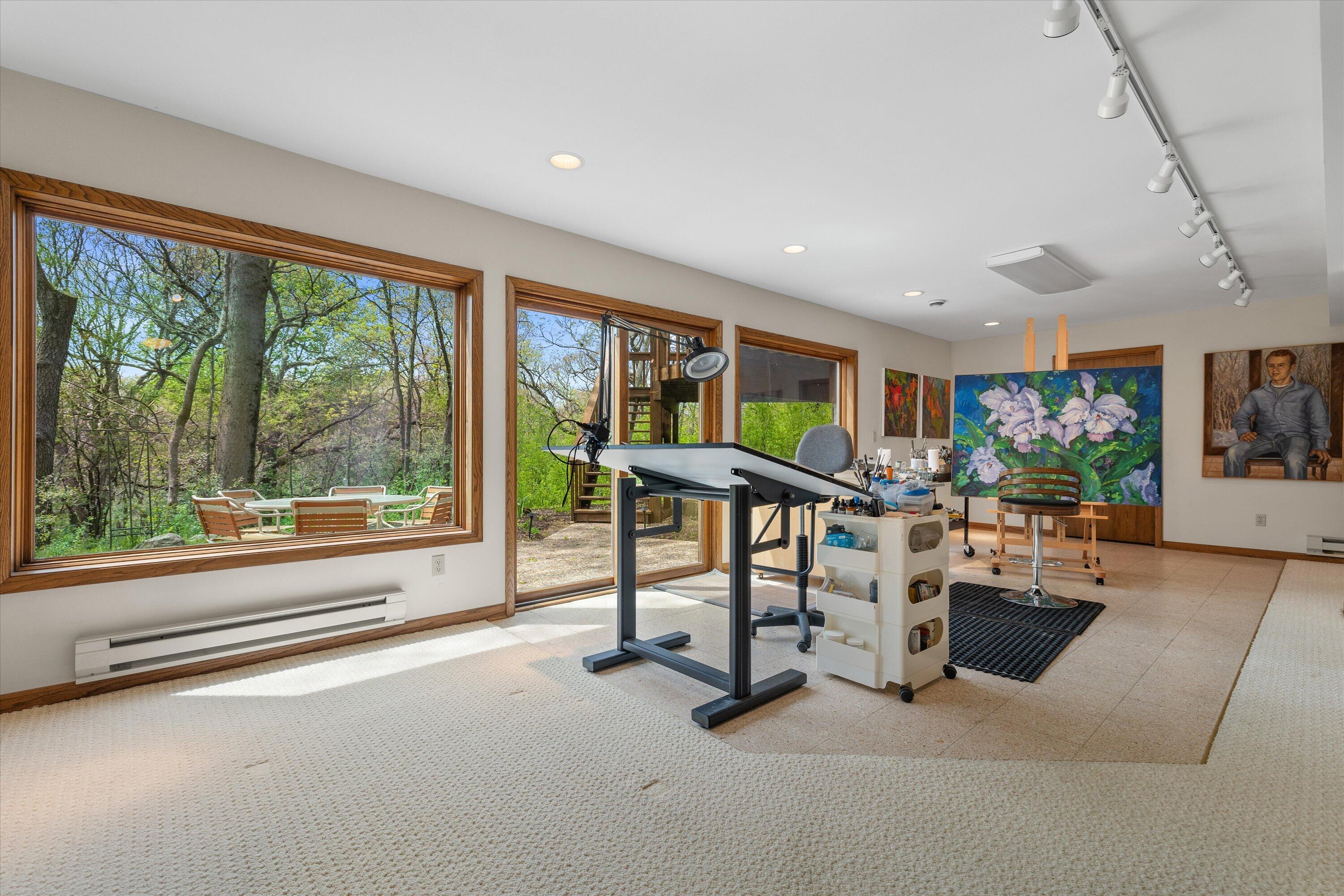 1161 North Lost Woods Road Summit, WI 53066 - Photo 22 of 66 Currently used as an art studio, the family room offers a full walk out and natural light galore.