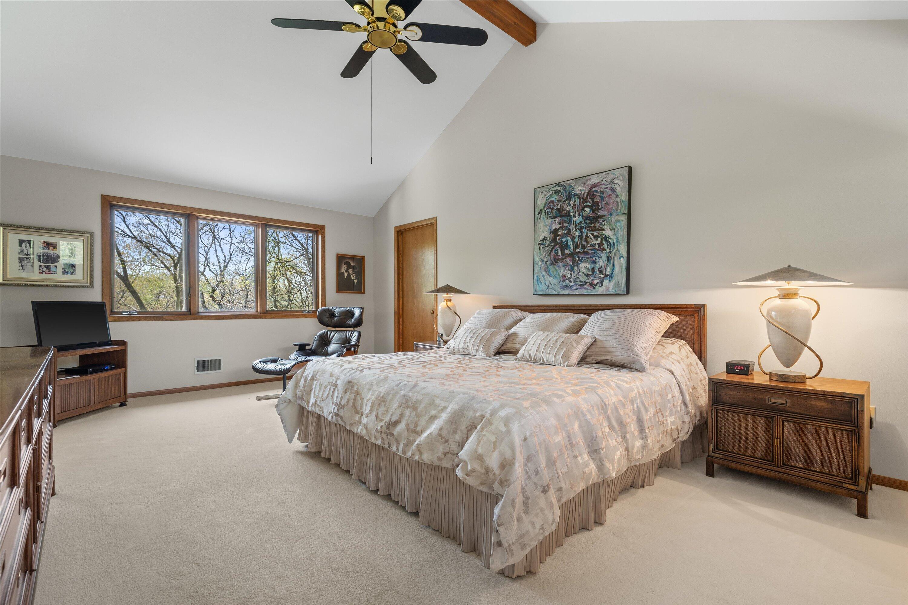 1161 North Lost Woods Road Summit, WI 53066 - Photo 26 of 66 Very private large and luxurious primary bedroom suite w/ vaulted ceilings and large walk in closet.