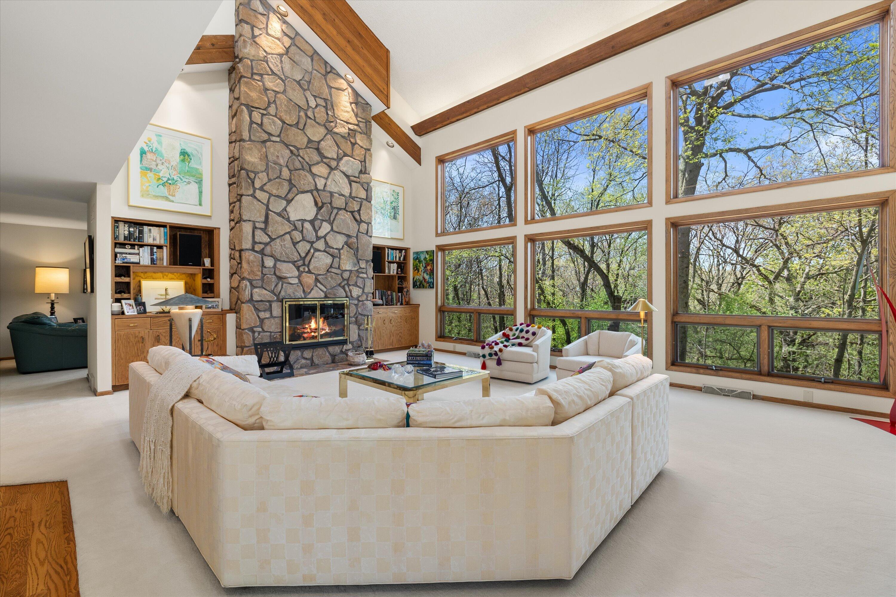 1161 North Lost Woods Road Summit, WI 53066 - Photo 2 of 66 Note the stunning stone fireplace reaching up to the vaulted ceiling.