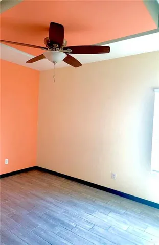 a close up of a lamp with wooden floor