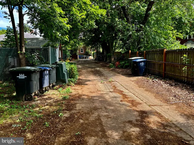 a view of street with parked cars