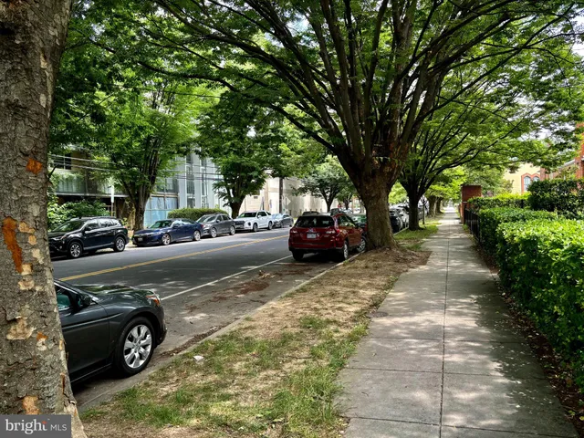 a view of street with parked cars
