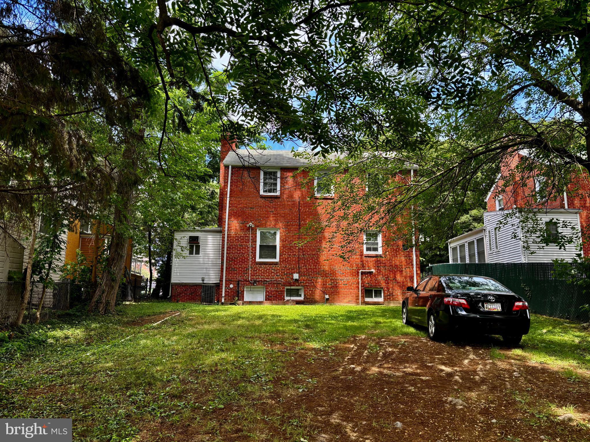 8028 Eastern Avenue Northwest Washington, DC 20012 - Photo 19 of 54 a view of a house with a back yard