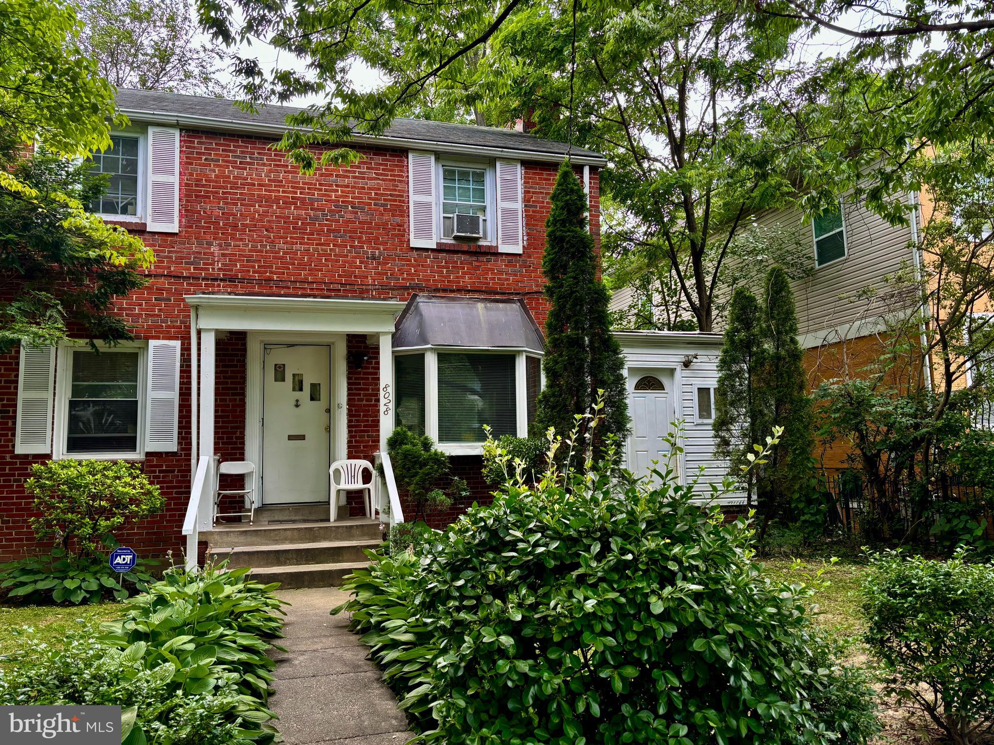 8028 Eastern Avenue Northwest Washington, DC 20012 - Photo 2 of 54 front view of a house with a porch