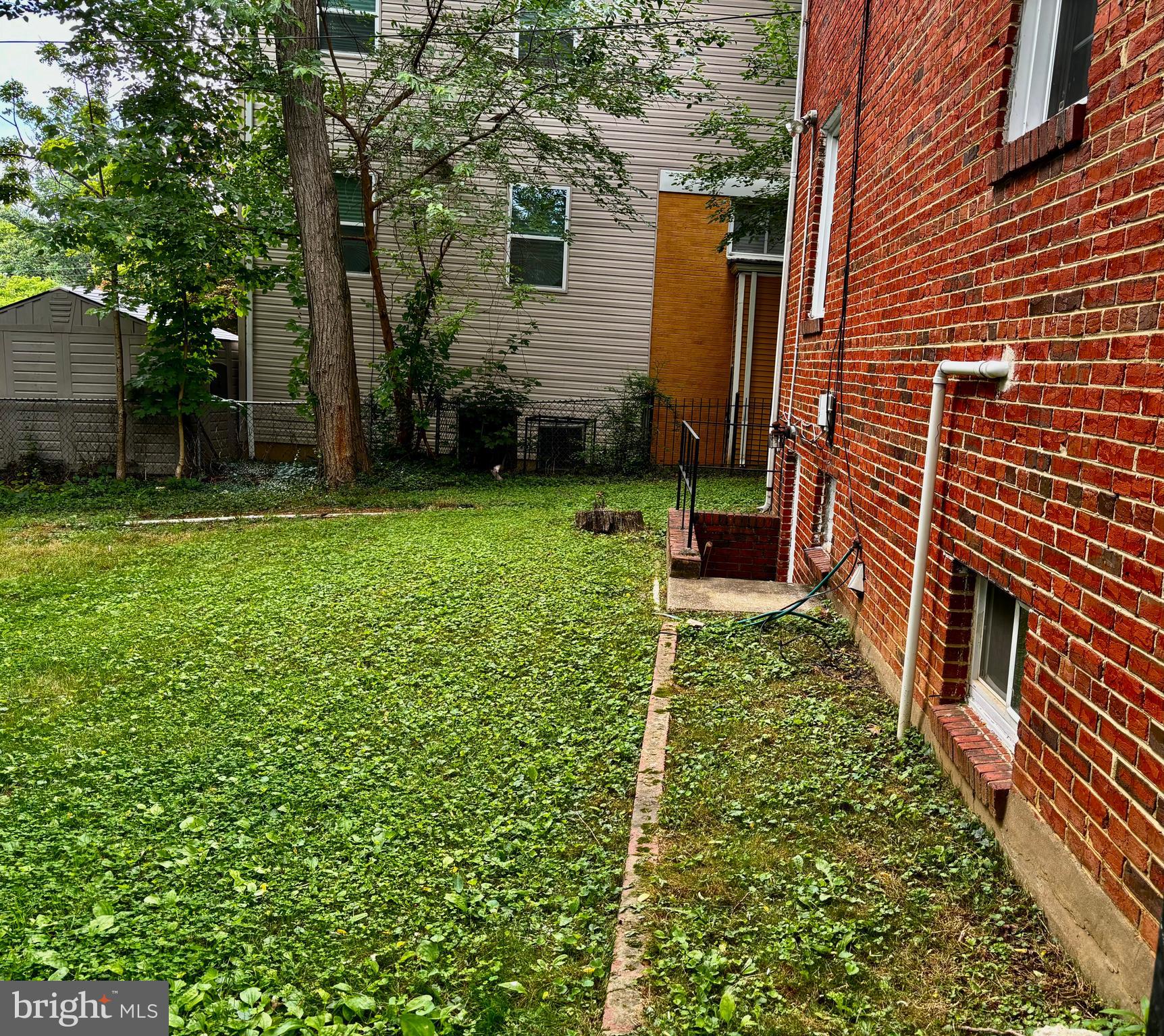 8028 Eastern Avenue Northwest Washington, DC 20012 - Photo 21 of 54 a backyard of a house with lots of green space