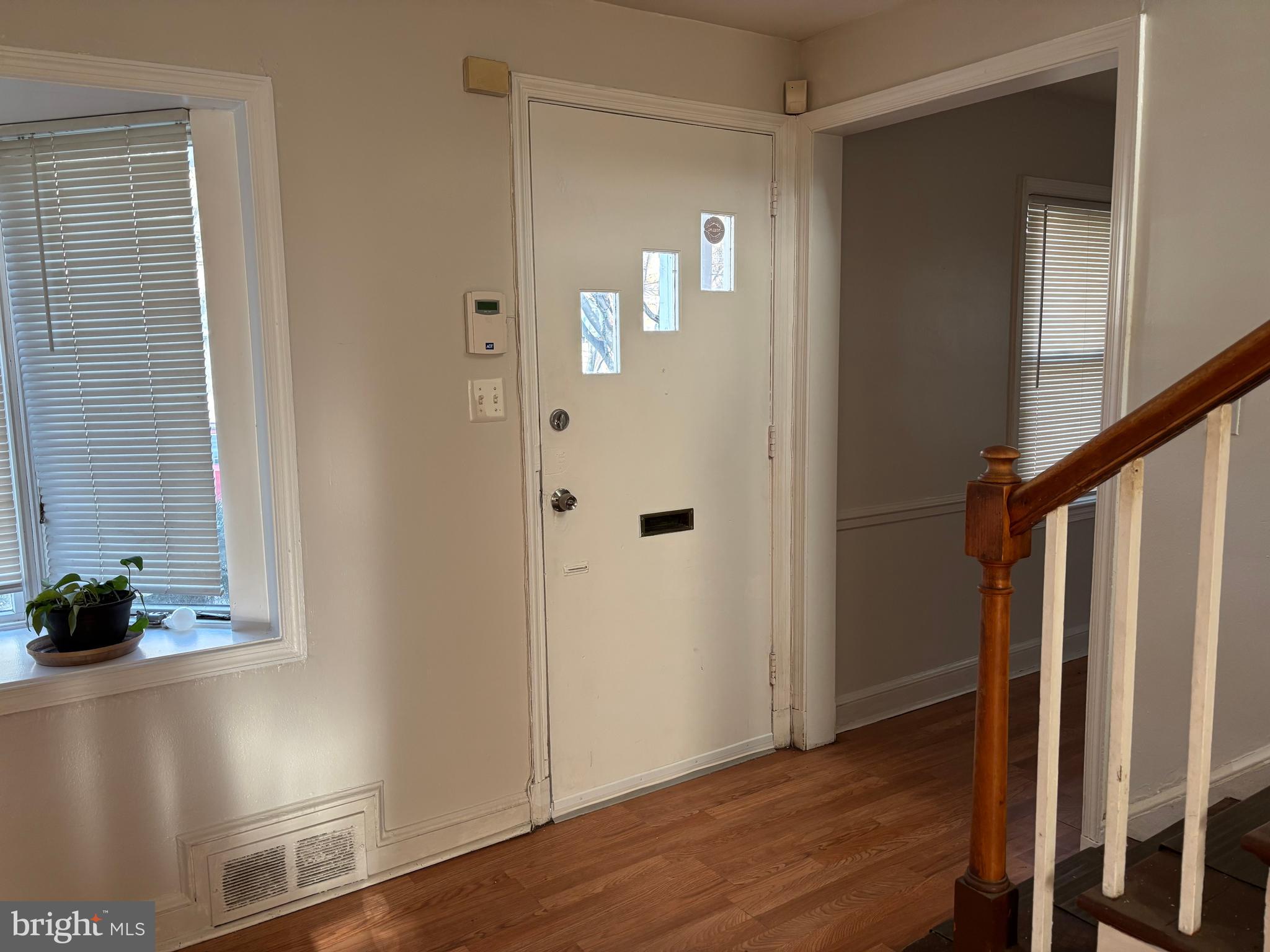 8028 Eastern Avenue Northwest Washington, DC 20012 - Photo 23 of 54 a view of a hallway with wooden floor and staircase