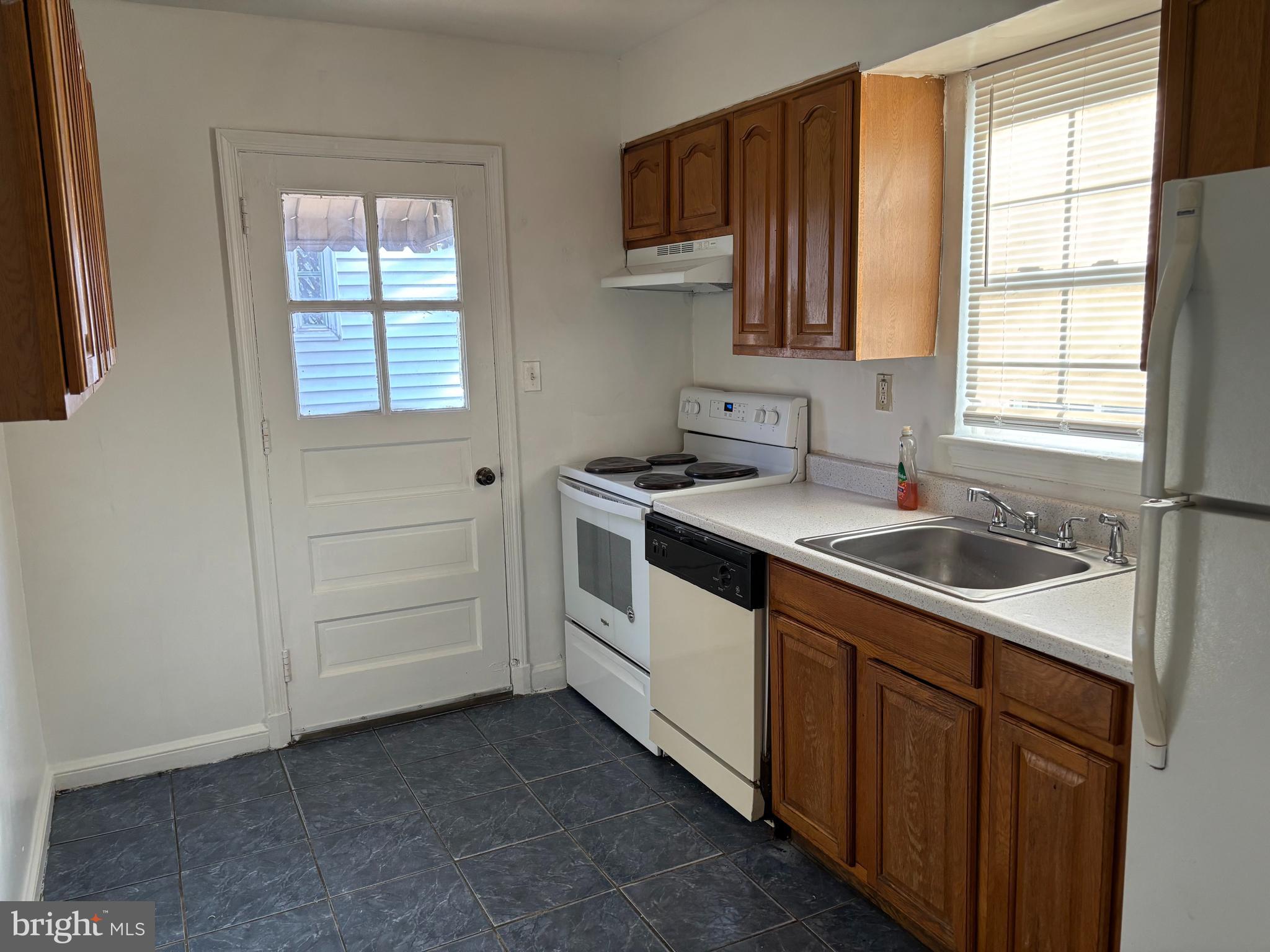 8028 Eastern Avenue Northwest Washington, DC 20012 - Photo 28 of 54 a kitchen that has a sink and a stove