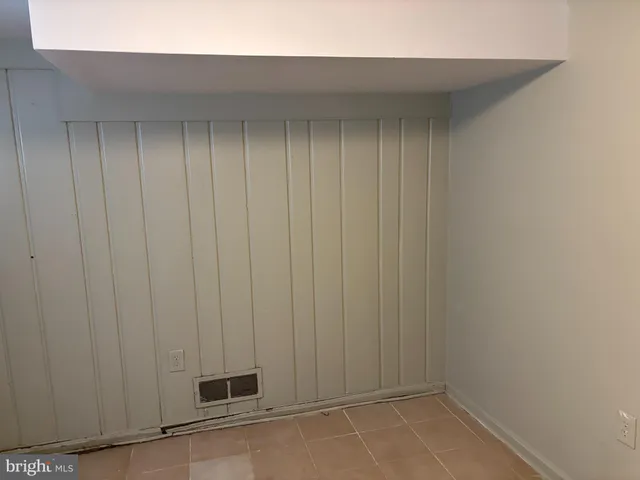 a view of storage and utility room with empty racks