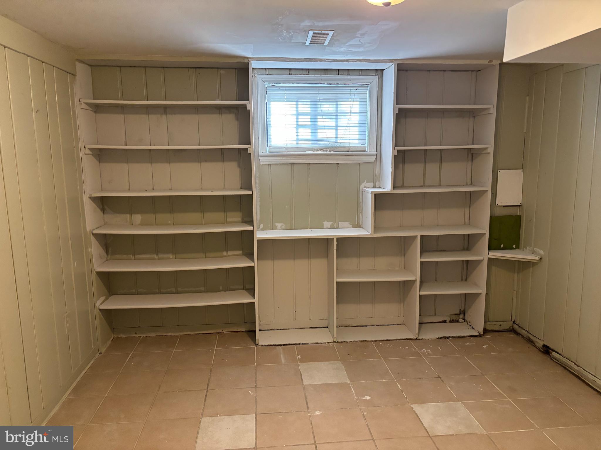 8028 Eastern Avenue Northwest Washington, DC 20012 - Photo 34 of 54 a view of room with empty cabinets and a window