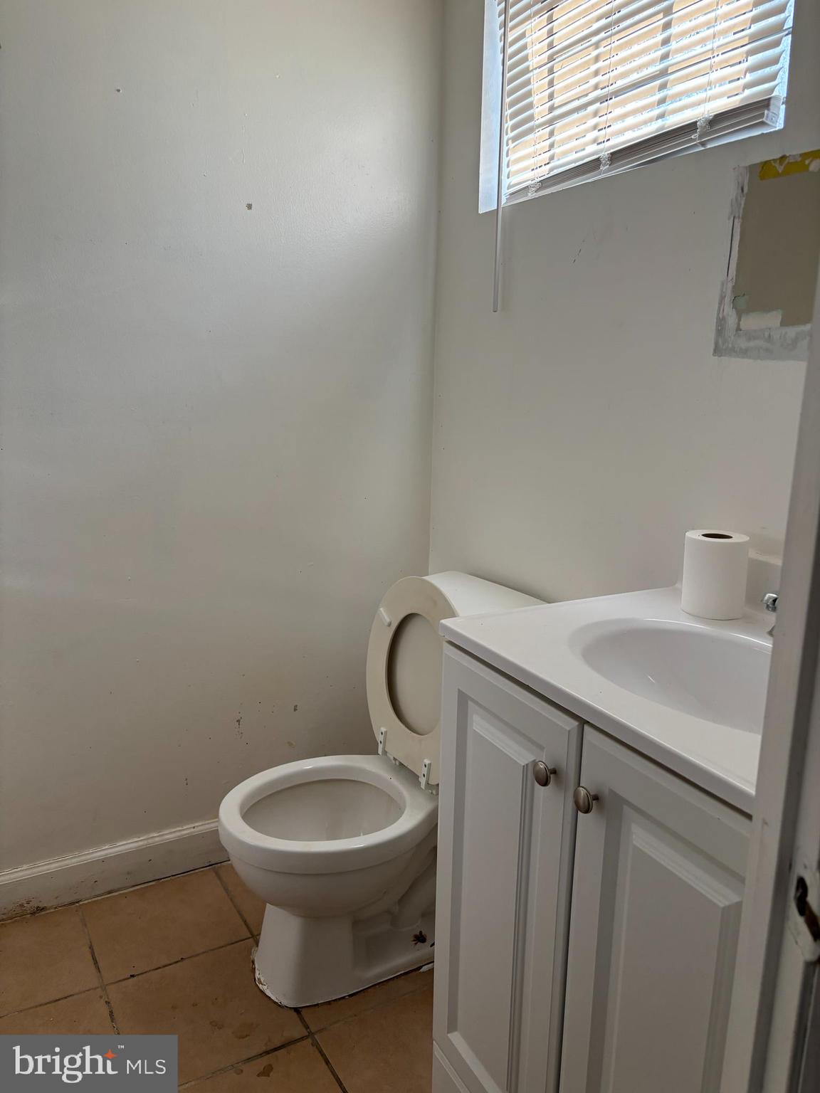 8028 Eastern Avenue Northwest Washington, DC 20012 - Photo 39 of 54 a bathroom with a toilet a sink and mirror