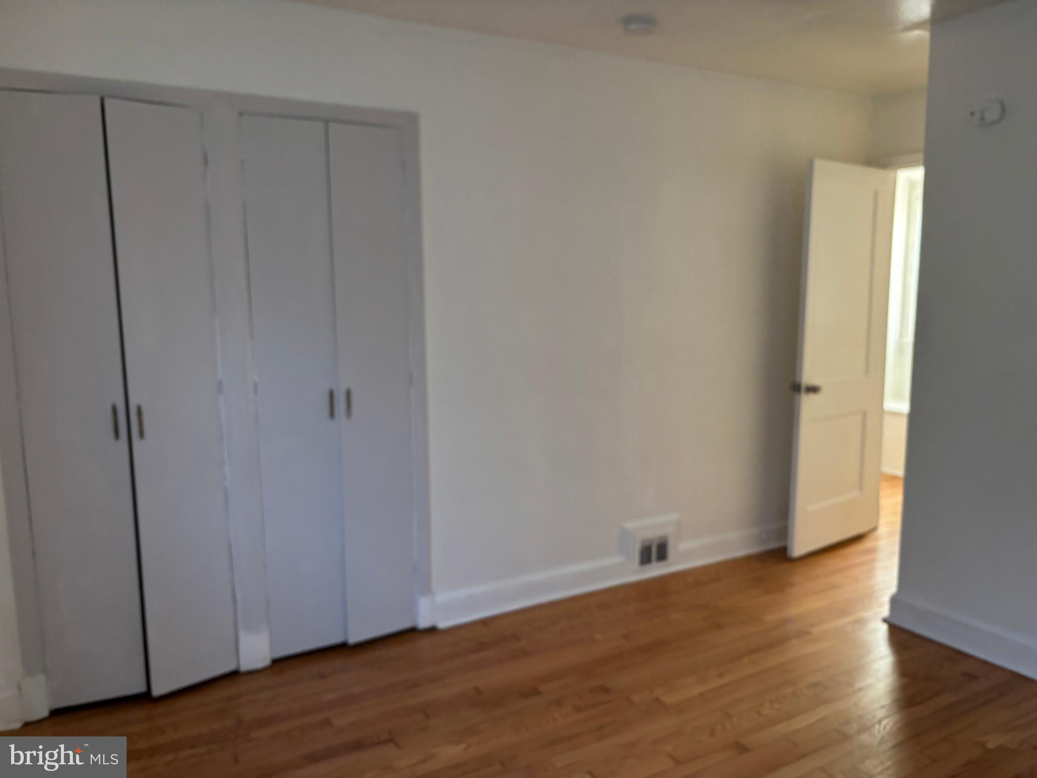 8028 Eastern Avenue Northwest Washington, DC 20012 - Photo 42 of 54 a view of an empty room with wooden floor