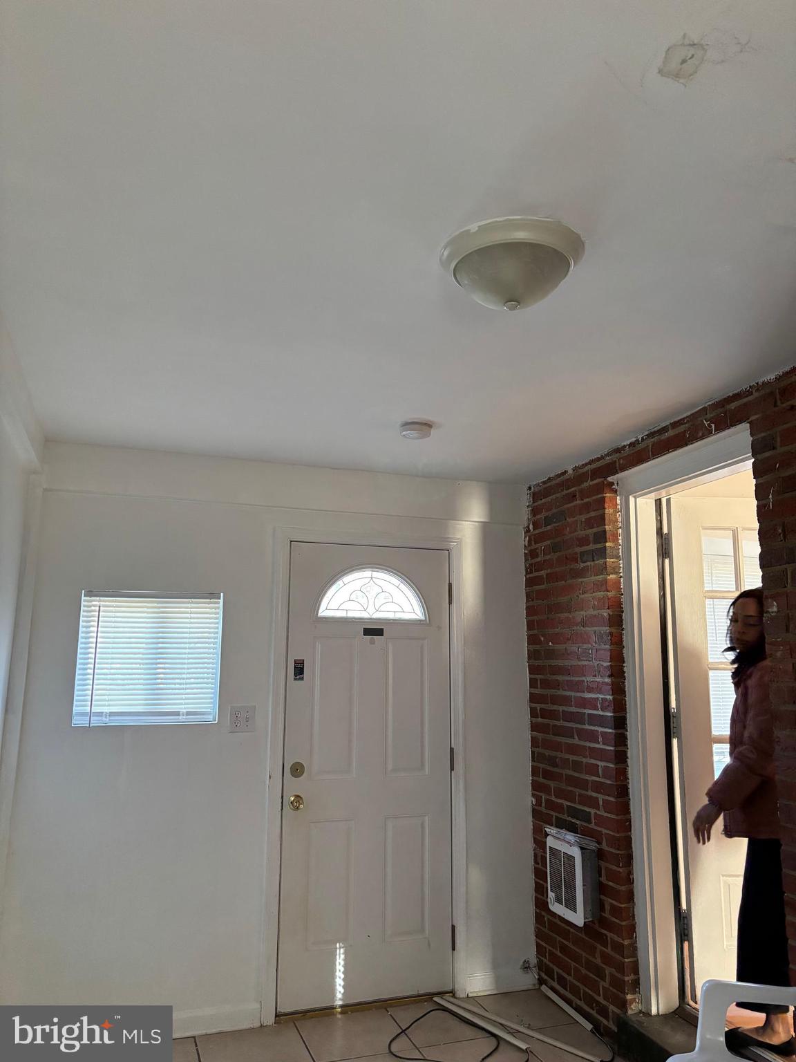8028 Eastern Avenue Northwest Washington, DC 20012 - Photo 46 of 54 a view of a hallway with wooden floor and staircase