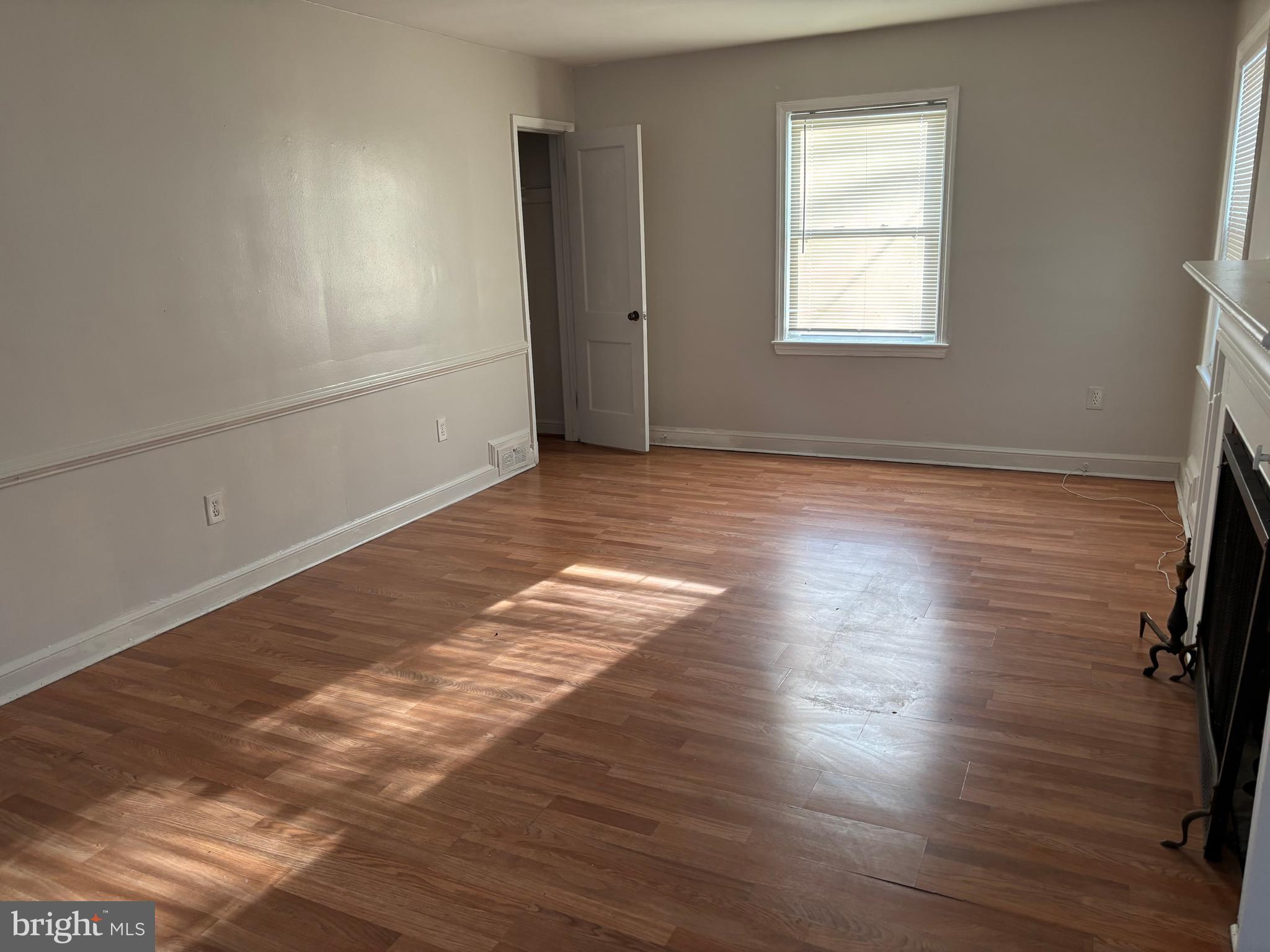 8028 Eastern Avenue Northwest Washington, DC 20012 - Photo 54 of 54 an empty room with wooden floor and windows