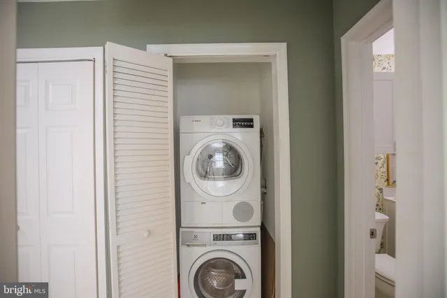 a utility room with dryer and washer