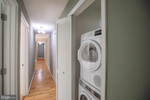 a view of a hallway with washer and dryer