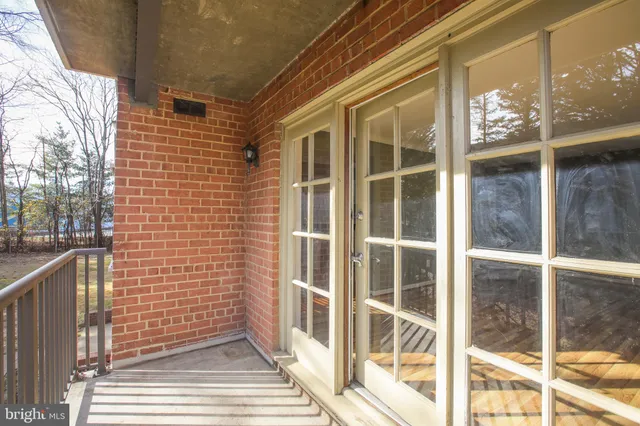 a view of a brick house with a large window