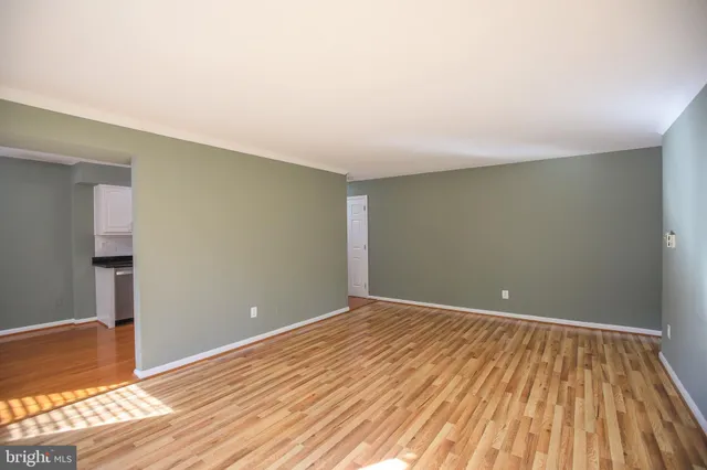 a view of room with wooden floor