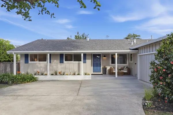 a front view of a house with a sitting area
