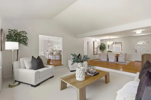 a bath room with a couch and a potted plant
