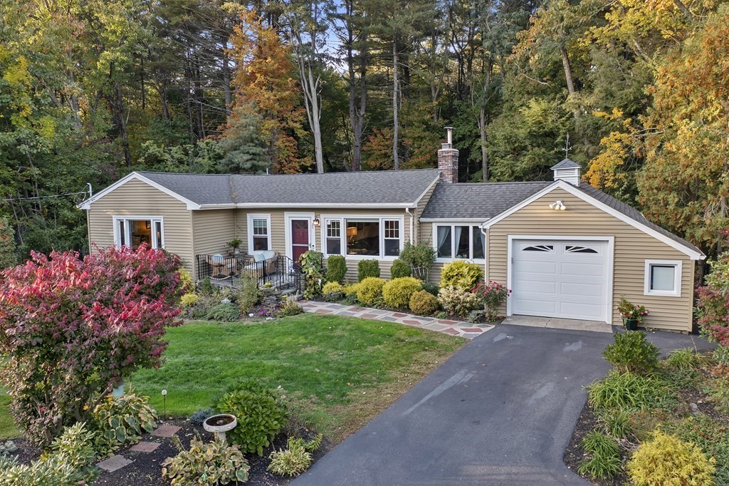 20 Howell Road Sudbury, MA 01776 - Photo 1 of 39 a front view of a house with a garden and porch