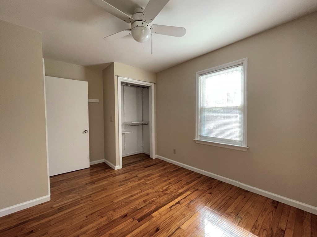 20 Howell Road Sudbury, MA 01776 - Photo 15 of 39 a view of an empty room with wooden floor and a window
