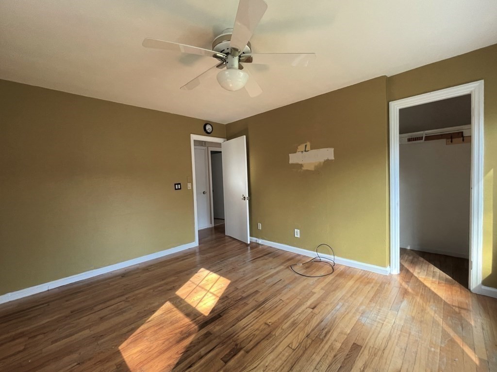 20 Howell Road Sudbury, MA 01776 - Photo 17 of 39 wooden floor in an empty room with a window