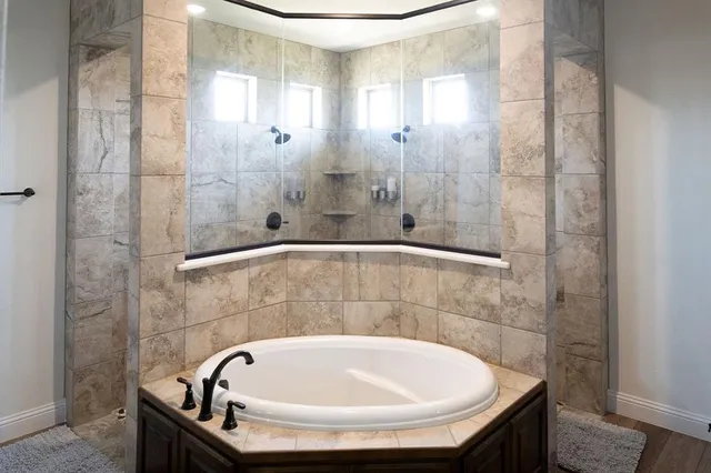 a bedroom with a bed and a potted plant