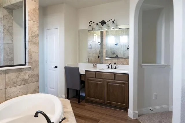 a bathroom with a sink and shower