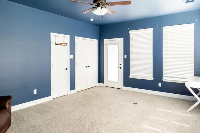 a building outdoor space with patio furniture and potted plant