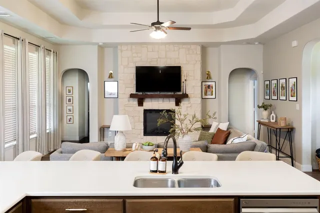 a living room with fireplace furniture and a flat screen tv