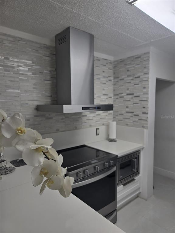 9410 Live Oak Place, Unit 103 Davie, FL 33324 - Photo 16 of 49 a kitchen with granite countertop a stove and a sink
