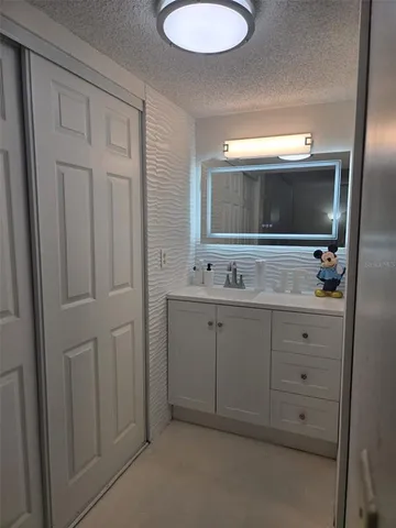 a bathroom with a double vanity sink and mirror